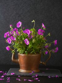 Close-up of pink flower pot on table