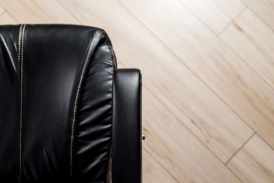 High angle view of shoes on hardwood floor