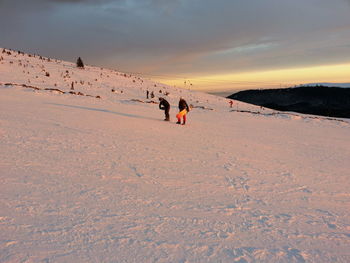 Scenic view of landscape against sky at sunset