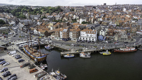 High angle view of river amidst buildings in city