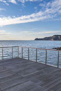 Pier over sea against sky