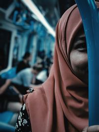 Close-up portrait of young woman in hijab