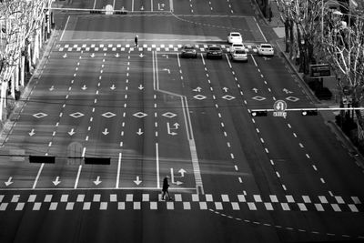 High angle view of men and cars on street