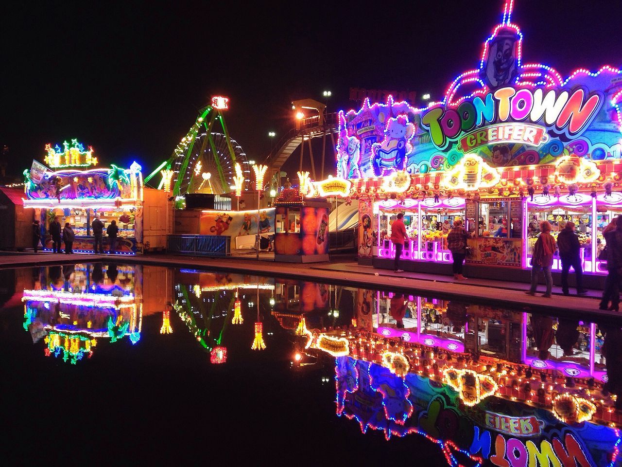 illuminated, night, multi colored, built structure, amusement park, arts culture and entertainment, architecture, amusement park ride, celebration, building exterior, lighting equipment, famous place, travel destinations, sky, decoration, tourism, cultures, city, carousel, tradition