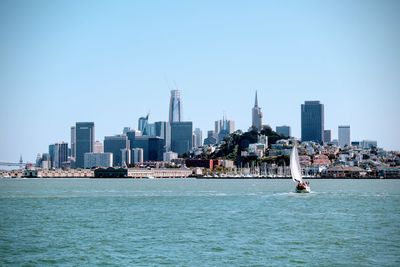 Sea with city in background