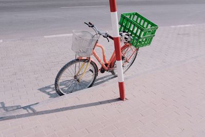 High angle view of bicycle parked on footpath