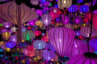 Low angle view of illuminated lanterns hanging on ceiling