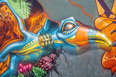 Full frame shot of multi colored graffiti on water