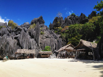 Panoramic view of beach against clear blue sky