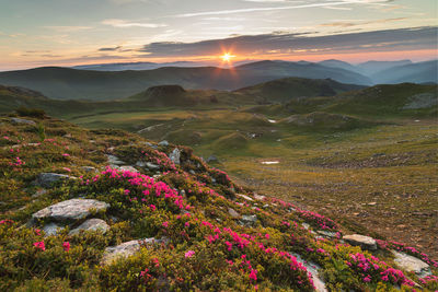 Scenic view of mountains against sky during sunset