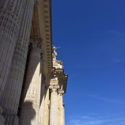 Low angle view of cross against blue sky
