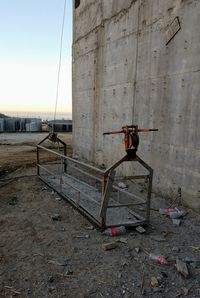 Abandoned building by sea against sky