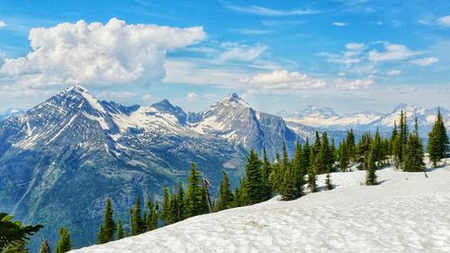 Scenic view of mountains against cloudy sky