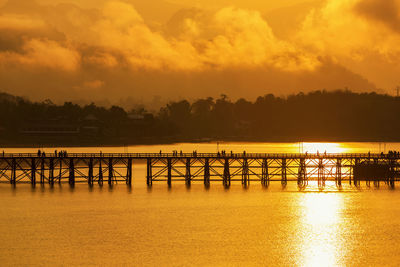 Scenic view of lake against orange sky