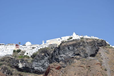 Low angle view of building against clear blue sky