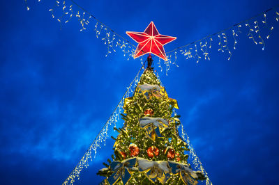 Low angle view of christmas tree against sky