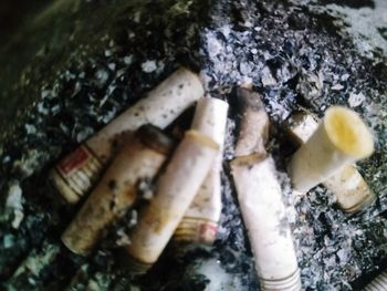 Close-up of cigarette smoking on wood