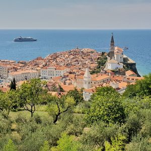 Scenic view of sea and buildings against sky