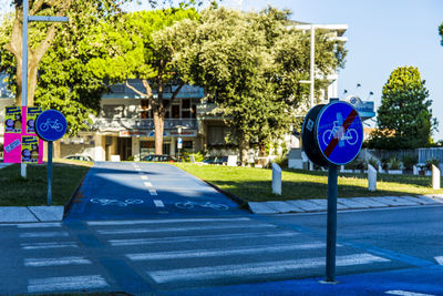 Road sign against blue sky