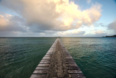 Pier over sea against sky