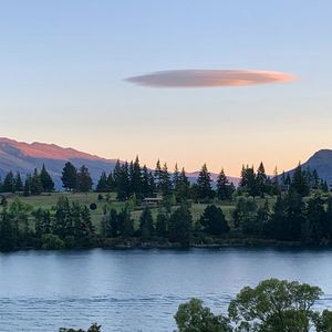 Scenic view of lake against sky at sunset