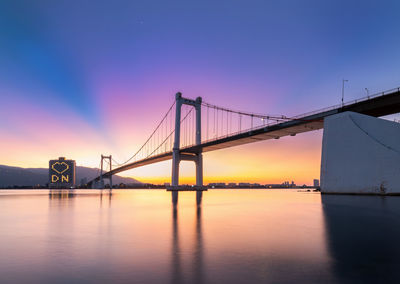 View of suspension bridge at sunset