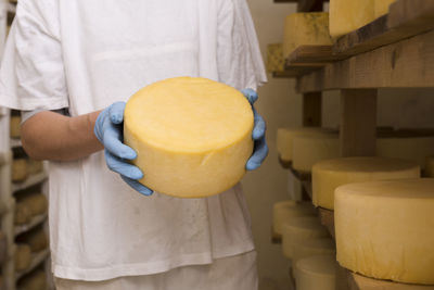 Midsection of man holding food