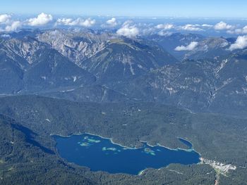 High angle view of snowcapped mountains against sky