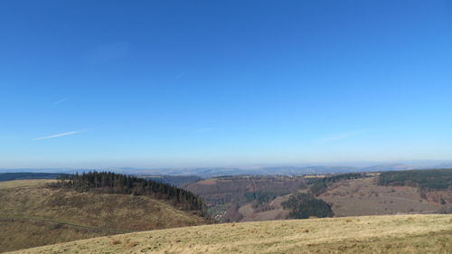 Scenic view of landscape against clear blue sky