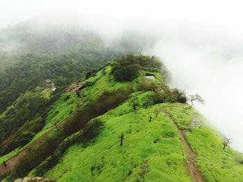 Scenic view of mountains against cloudy sky