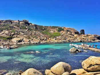 Scenic view of sea against clear blue sky