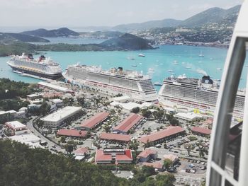 High angle view of cruise ships by sea against sky