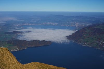 High angle view of bay against clear blue sky