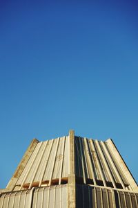 Low angle view of building against blue sky