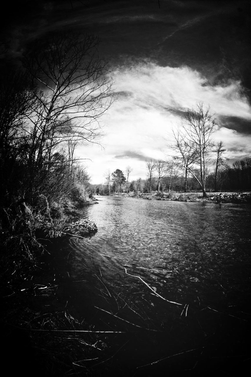 water, sky, tree, bare tree, cloud - sky, river, tranquility, nature, branch, cloudy, tranquil scene, lake, scenics, built structure, building exterior, architecture, cloud, beauty in nature, waterfront, outdoors