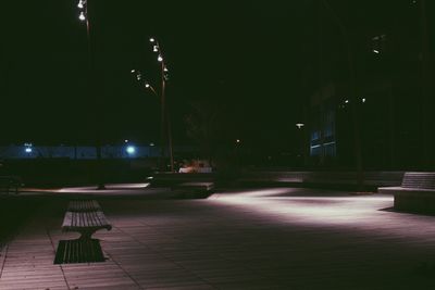 View of illuminated street lights at night