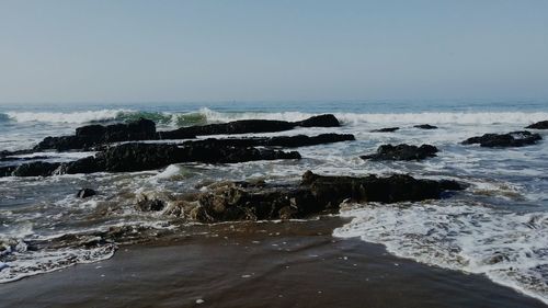 Scenic view of sea against clear sky