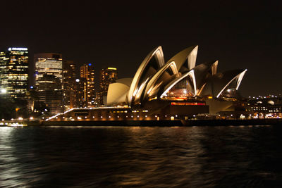 Illuminated buildings in city at night