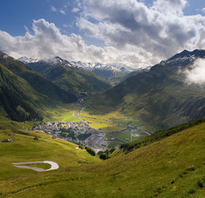 Scenic view of landscape and mountains against sky