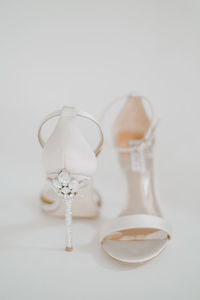 Close-up of empty glass over white background