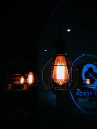 Close-up of illuminated lamp at night