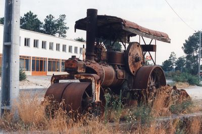 Abandoned tractor in farm against sky