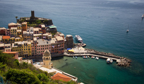 High angle view of buildings by sea