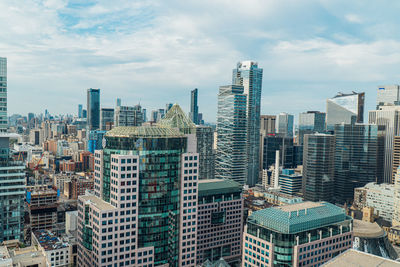 Modern buildings in city against sky