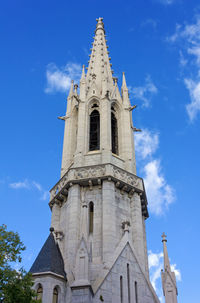 Low angle view of clock tower against sky