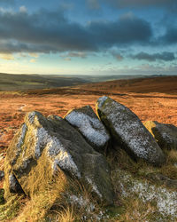 Scenic view of land against sky during sunset