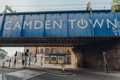 Information sign on road by building