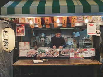 Portrait of man standing in store