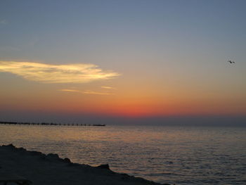 Scenic view of sea against sky at sunset