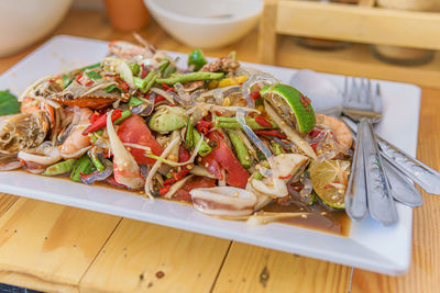 High angle view of vegetables in plate on table